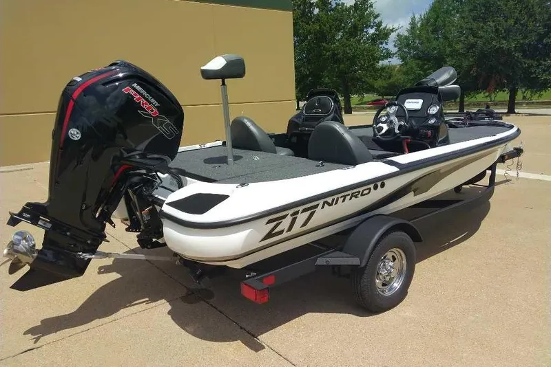 Slide: The Image of 2025 Nitro Z17 boat with Mercury engine, parked outdoors on a trailer. - 4