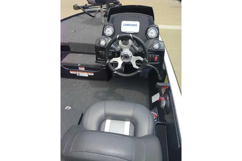 Slide: The Image of 2025 Nitro Z17 boat cockpit with steering wheel and Lowrance display. - 8