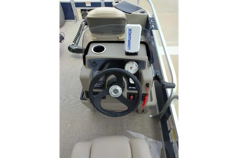 Slide: The Image of 2025 Sun Tracker Bass Buggy 18 DLX boat console with steering wheel and Lowrance device. - 5