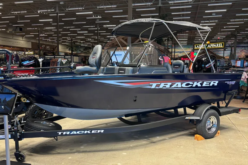 The Image of 2026 Tracker Pro Guide V-175 Combo boat displayed indoors on a trailer. - 0