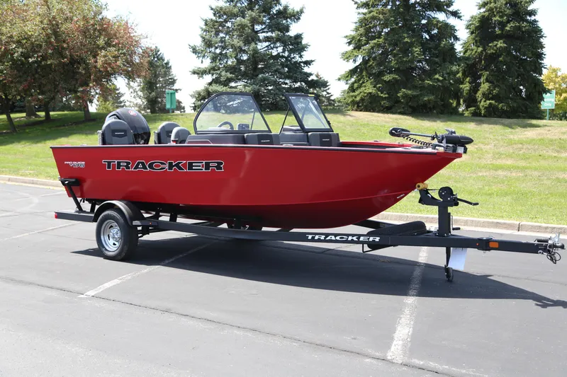The Image of 2026 Tracker Pro Guide V-175 Combo boat on trailer, parked outdoors. - 0