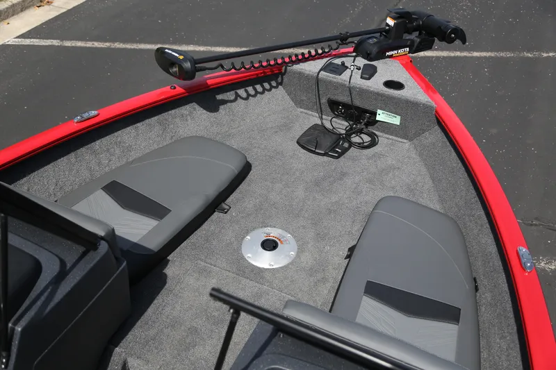 Slide: The Image of 2026 Tracker Pro Guide V-175 Combo boat interior with seating and trolling motor. - 2