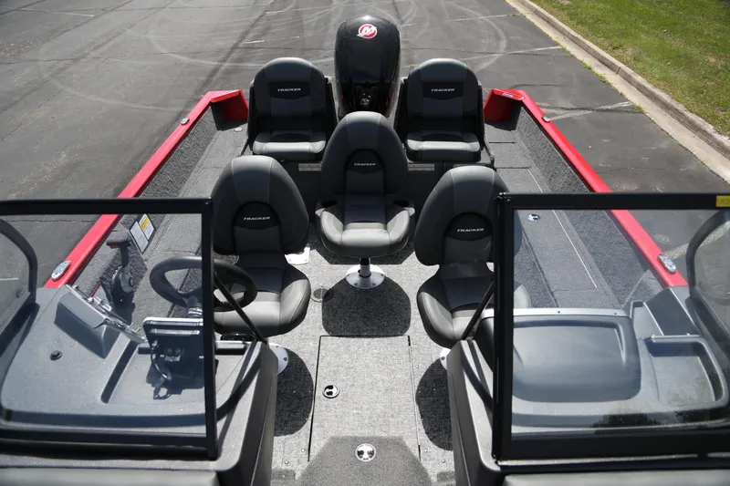 Slide: The Image of 2026 Tracker Pro Guide V-175 Combo boat interior with seating and steering wheel. - 3