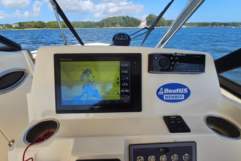 Slide: The Image of Dashboard of a 2016 Scout 275 Dorado boat with navigation system and controls. - 18