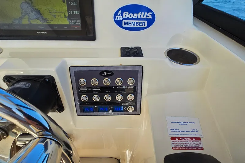 Slide: The Image of Control panel of a 2016 Scout 275 Dorado boat with navigation display. - 19