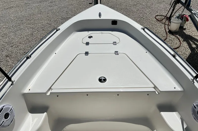 Slide: The Image of 2026 Key West 1720 Center Console boat deck with storage compartments. - 10