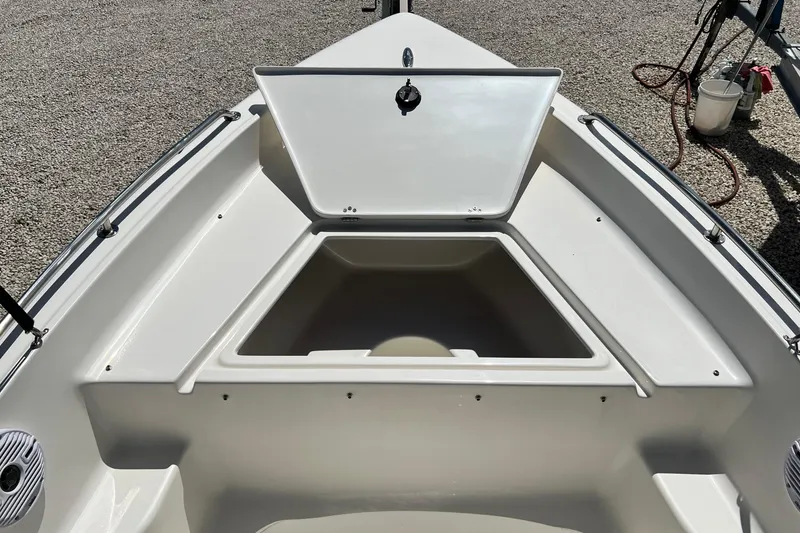 Slide: The Image of 2026 Key West 1720 Center Console boat with open storage compartment. - 11