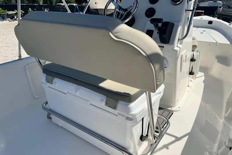 Slide: The Image of 2026 Key West 1720 Center Console boat interior with cushioned seating and steering console. - 16