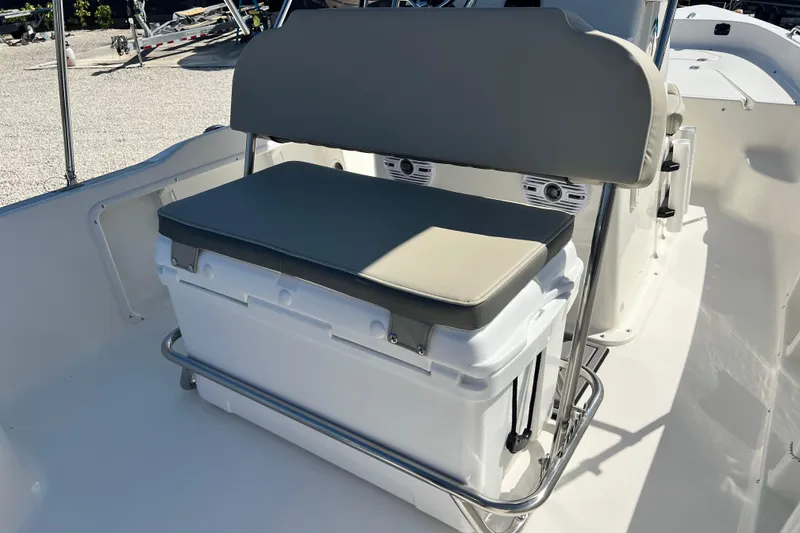 Slide: The Image of 2026 Key West 1720 Center Console boat seat with integrated cooler and cushion. - 17
