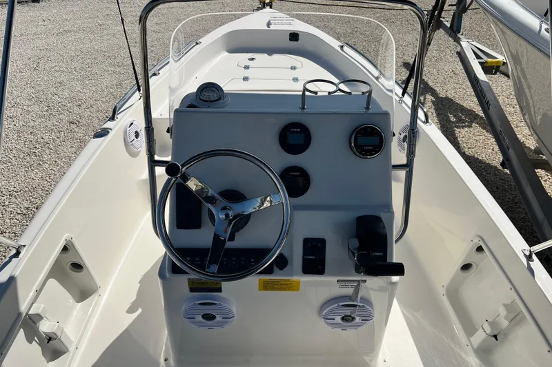 Slide: The Image of 2026 Key West 1720 Center Console boat interior with steering wheel and controls. - 19