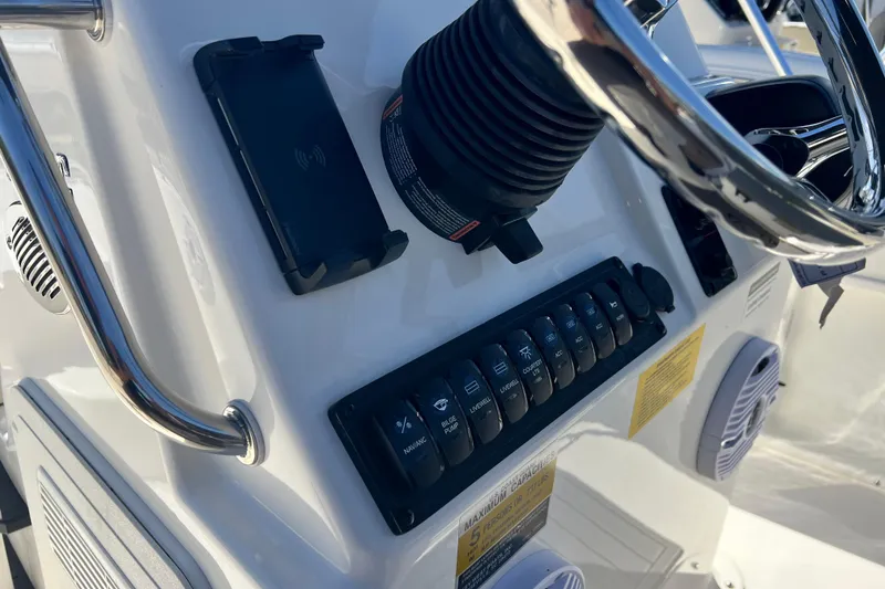 Slide: The Image of 2026 Key West 1720 Center Console boat dashboard with steering wheel and control panel. - 20