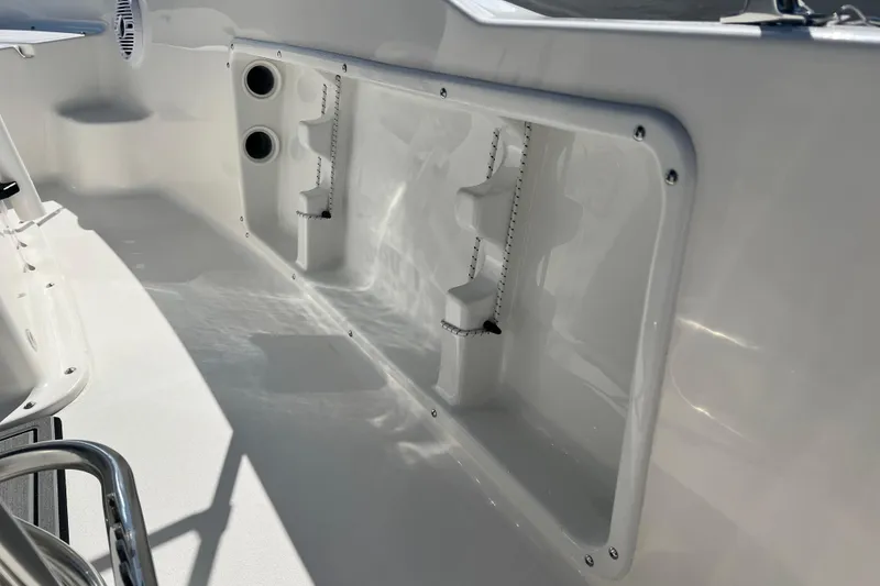 Slide: The Image of 2026 Key West 1720 Center Console boat interior with storage compartments and speaker. - 24