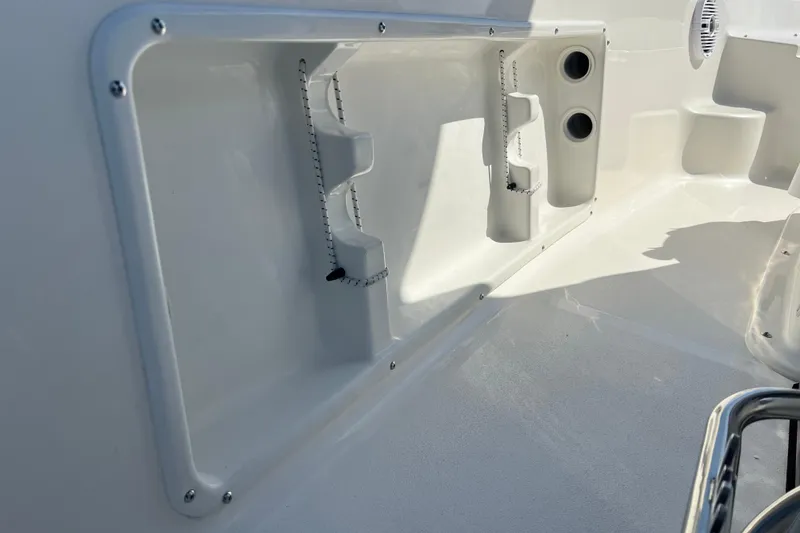 Slide: The Image of 2026 Key West 1720 Center Console interior detail with rod holders and storage compartments. - 25