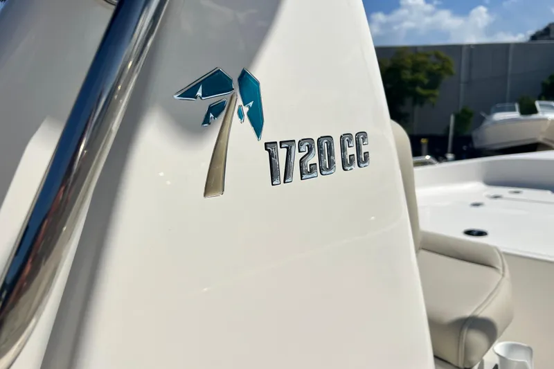 Slide: The Image of 2026 Key West 1720 Center Console boat, close-up of logo and seating area. - 29