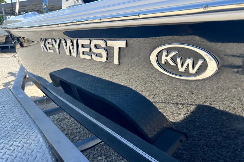 Slide: The Image of 2026 Key West 1720 Center Console boat on trailer, close-up of logo and hull. - 30