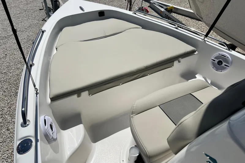 Slide: The Image of 2026 Key West 1720 Center Console boat interior with cushioned seating and speaker. - 8