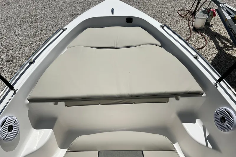 Slide: The Image of 2026 Key West 1720 Center Console boat with cushioned seating and speakers. - 9