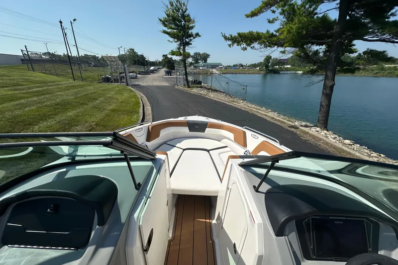 Slide: The Image of 2026 CHAPPARRAL 23 SSi boat on a scenic lakeside road. - 14