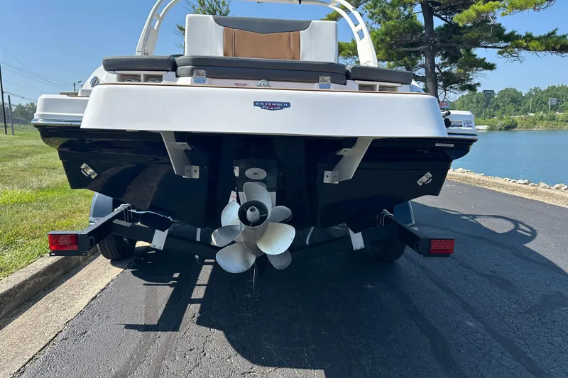 Slide: The Image of Rear view of 2026 CHAPPARRAL 23 SSi boat on trailer by a lake. - 4