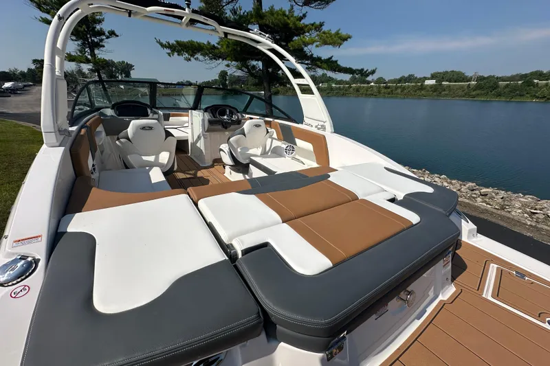 Slide: The Image of 2026 CHAPPARRAL 23 SSi boat with luxurious seating by a serene lake. - 7