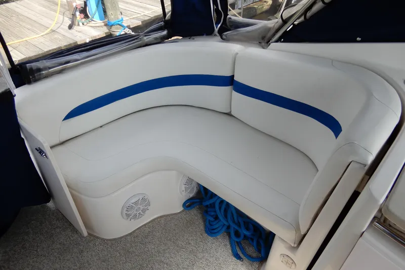 Slide: The Image of 2002 Chaparral Signature 320 boat interior with white and blue seating. - 10