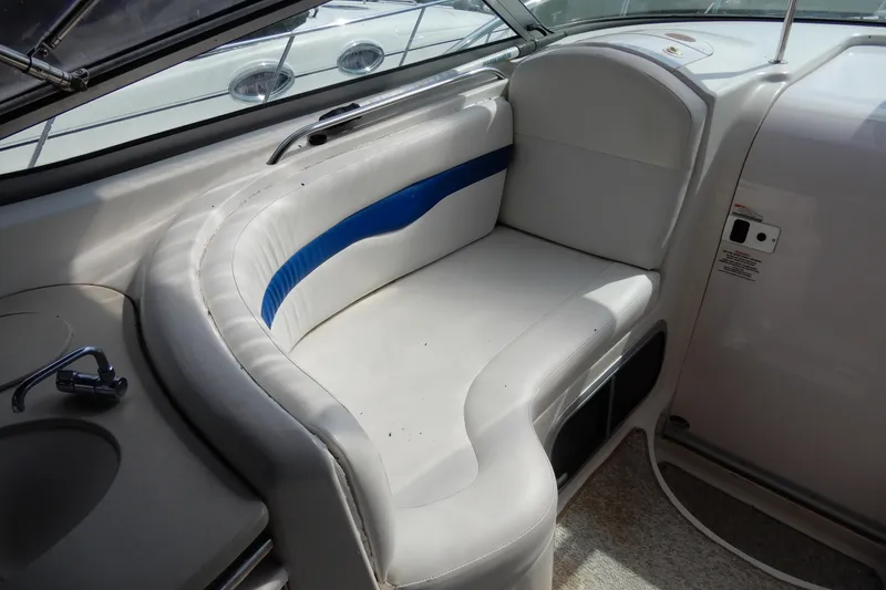 Slide: The Image of 2002 Chaparral Signature 320 boat interior with white and blue seating. - 16
