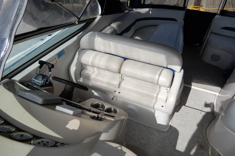 Slide: The Image of Interior of 2002 Chaparral Signature 320 boat with seating and control panel. - 20