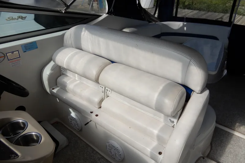Slide: The Image of 2002 Chaparral Signature 320 boat interior with white seating and cup holders. - 21