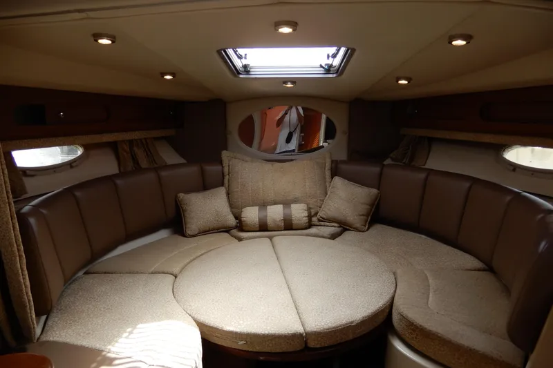 Slide: The Image of Interior of 2002 Chaparral Signature 320 boat with cozy seating and cushions. - 26