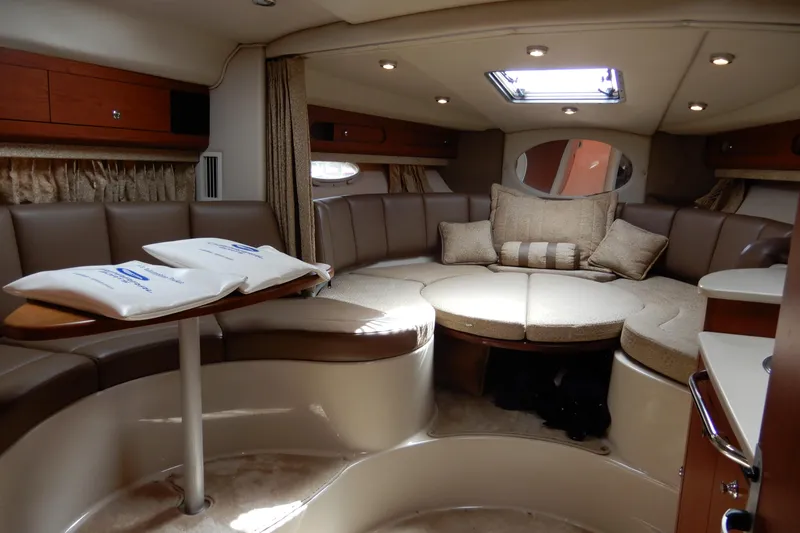 Slide: The Image of Luxurious interior of 2002 Chaparral Signature 320 yacht with plush seating and elegant decor. - 28