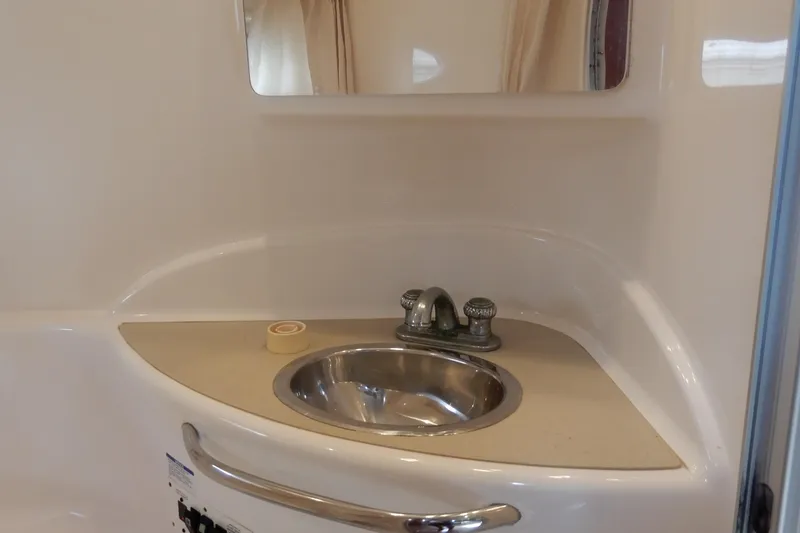 Slide: The Image of 2002 Chaparral Signature 320 bathroom sink with mirror and faucet. - 33