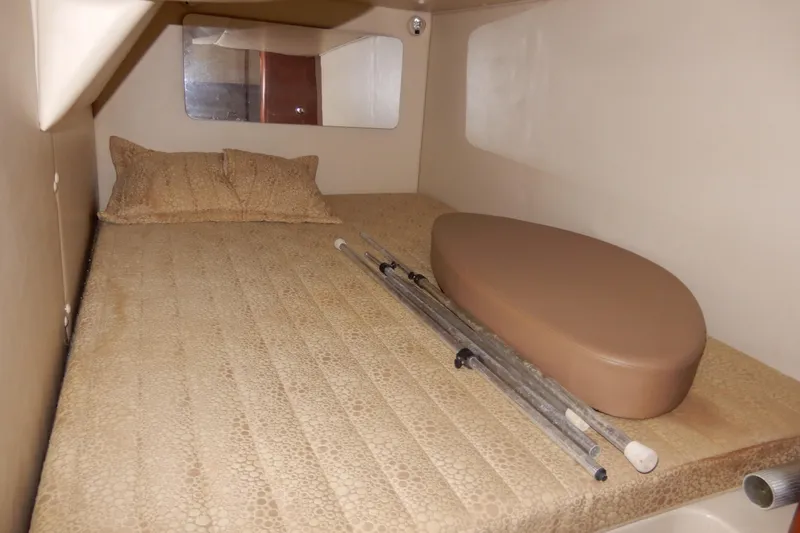 Slide: The Image of 2002 Chaparral Signature 320 cabin interior with bed and accessories. - 37