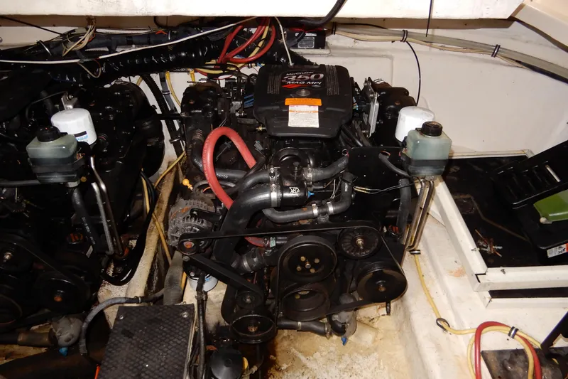Slide: The Image of Engine compartment of 2002 Chaparral Signature 320 boat, featuring a MerCruiser 350 MAG MPI engine. - 42
