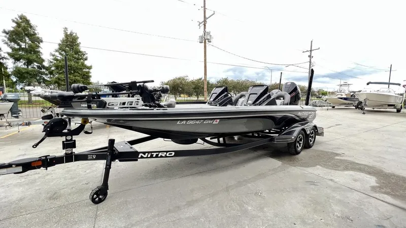 Slide: The Image of 2021 Nitro Z21 boat on trailer in outdoor setting. - 12