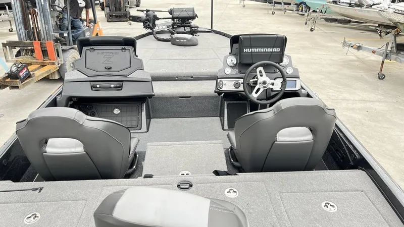Slide: The Image of 2021 Nitro Z21 boat interior with steering wheel and Humminbird electronics. - 13