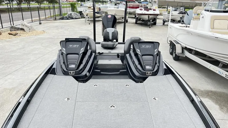 Slide: The Image of 2021 Nitro Z21 boat with dual engines, parked in a marina. - 16