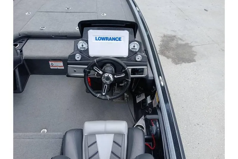 Slide: The Image of 2021 Nitro Z21 boat cockpit with Lowrance display and steering wheel. - 18