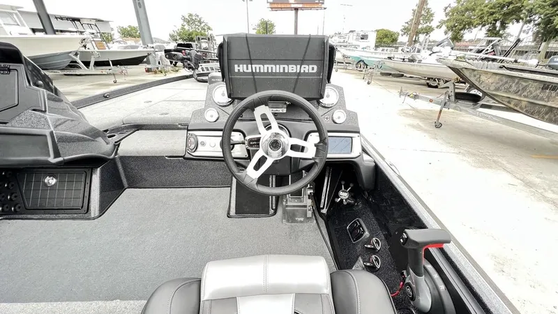 Slide: The Image of 2021 Nitro Z21 boat cockpit with Humminbird electronics and steering wheel. - 3