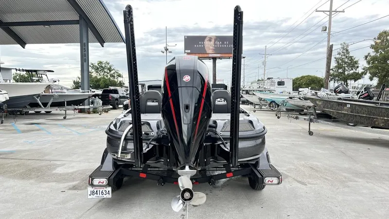 Slide: The Image of 2021 Nitro Z21 boat with powerful outboard motor, parked in a marina. - 5