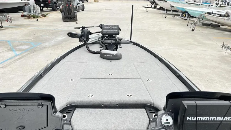 Slide: The Image of 2021 Nitro Z21 boat deck with Humminbird electronics in a marina setting. - 6