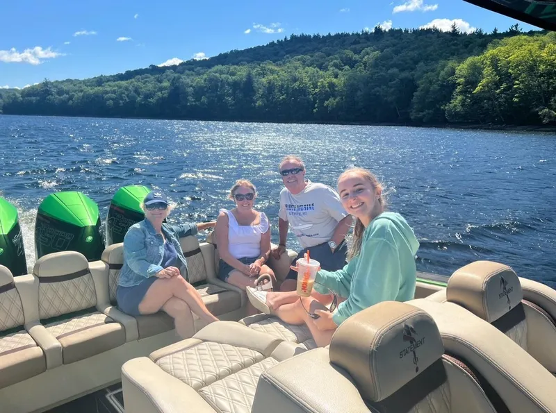 Slide: The Image of Group enjoying a sunny day on a 2018 Statement 380 Open boat. - 5
