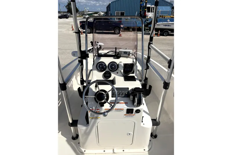 Slide: The Image of 2020 Bayliner Element F18 boat console with steering wheel and gauges. - 2