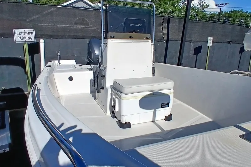 Slide: The Image of 2015 Starcraft 170 boat interior with seating and cooler in customer parking area. - 5