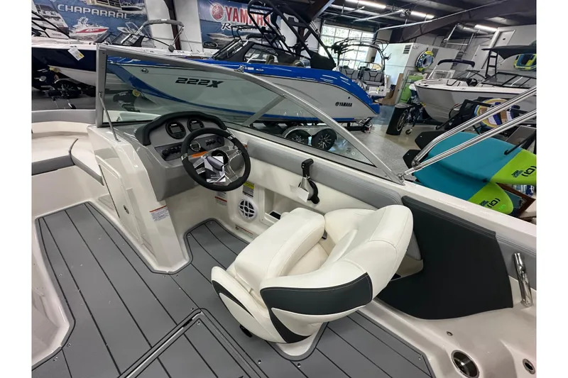Slide: The Image of Interior of 2026 Chaparral 21 SSi boat with steering wheel and seating. - 10