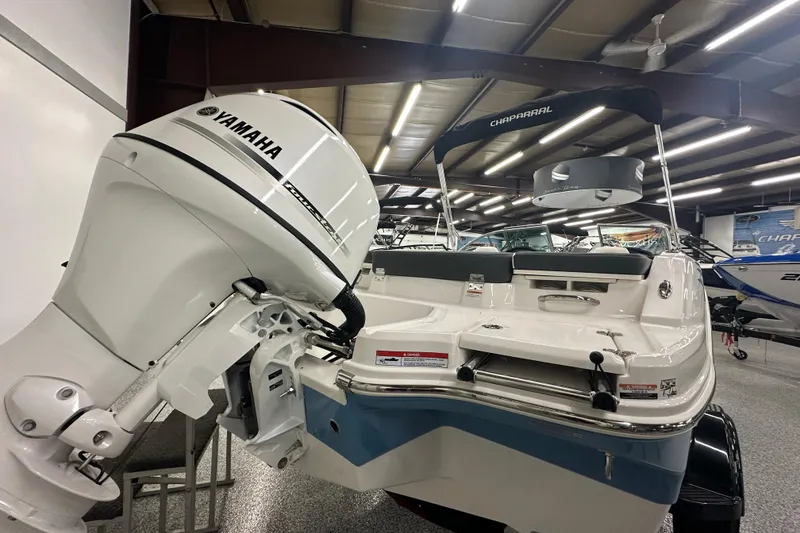 Slide: The Image of 2026 Chaparral 21 SSi boat with Yamaha outboard motor in showroom. - 17