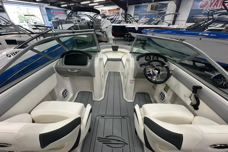 Slide: The Image of Interior view of 2026 Chaparral 21 SSi boat with modern dashboard and seating. - 9