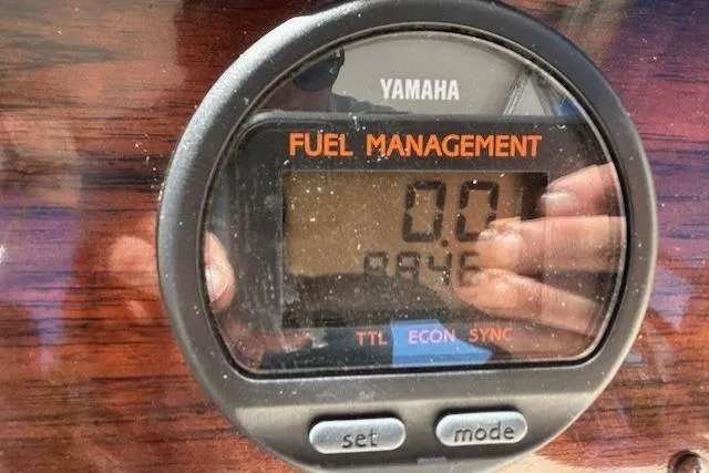 Slide: The Image of Yamaha fuel management display on 1999 Grady-White Sailfish 272 boat dashboard. - 12