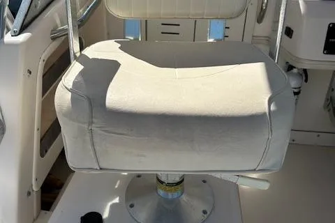 Slide: The Image of 1999 Grady-White Sailfish 272 boat seat, white upholstery, sturdy metal frame. - 18