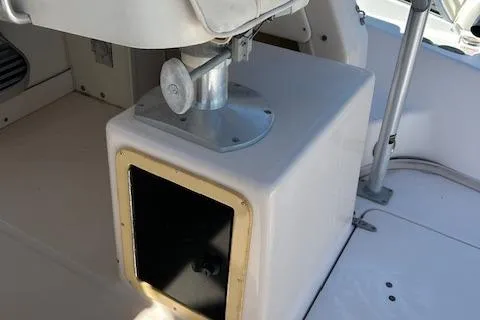 Slide: The Image of 1999 Grady-White Sailfish 272 boat interior detail with seat mount and storage compartment. - 19