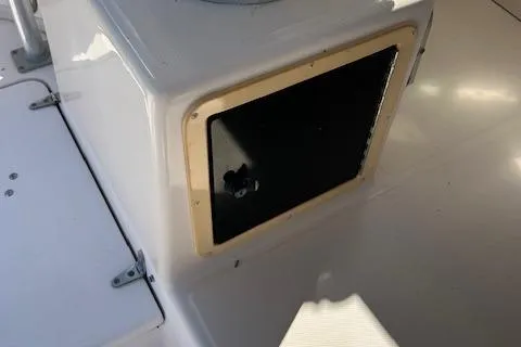 Slide: The Image of 1999 Grady-White Sailfish 272 boat compartment, white exterior, open storage area. - 20